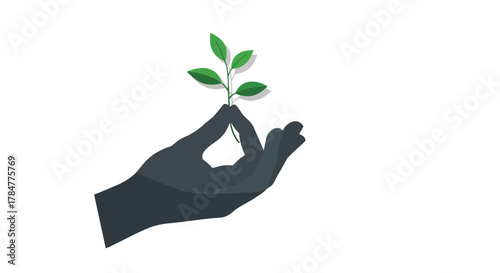 A dark silhouette of a hand gently holds a delicate green sprout with fresh leaves symbolizing growth and new beginnings
