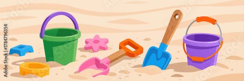 Colorful beach toys scattered on sand