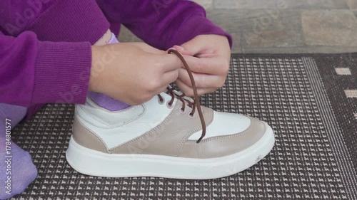 sneakers, tying, laces, practice, little girl sits on the threshold and ties laces on sneakers