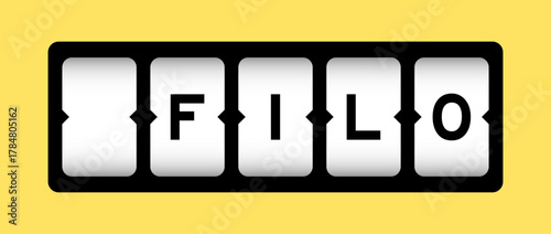 Black color in word FILO (abbreviation of first in last out) on slot banner with yellow color background