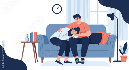 A caring man gently comforts an upset woman crying on a sofa, providing emotional support in a cozy home environment.