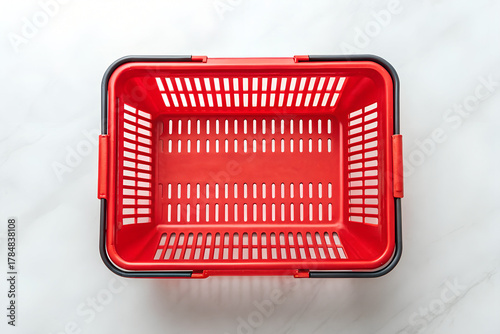 Overhead view of a vibrant red plastic shopping basket on png, shopping basket, red basket, plastic basket, store basket, supermarket basket, shopping container, retail, grocery, market, container