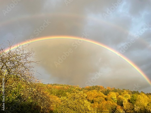 Rainbow over the mountain, fall season