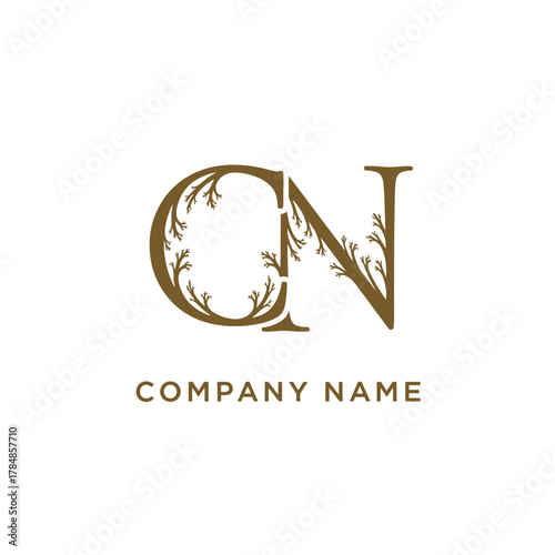 Elegant CN letter monogram logo with floral branch decoration.