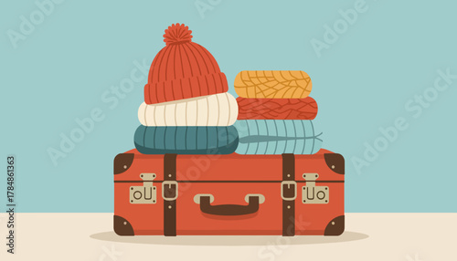 A vintage suitcase with a stack of warm winter clothes. Packing for a holiday trip concept. Retro flat design vector illustration