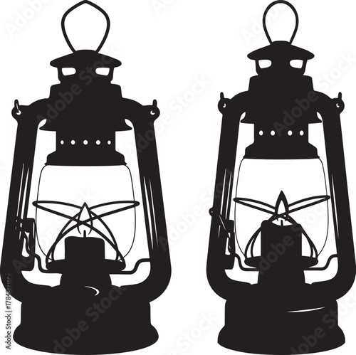 Two vintage kerosene lanterns in black silhouette