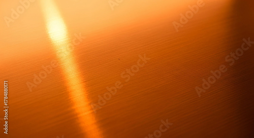 Warm orange and yellow light flare overlay abstract background