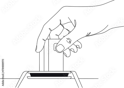 Hand inserting a credit card into a payment terminal for a transaction