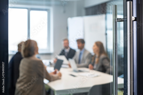 Photos Businessmen blur in the workplace in office with computer or shallow depth of fo