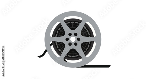 A classic film reel icon. A gray reel with black film inside and a strip of film trailing from the side against a white backdrop