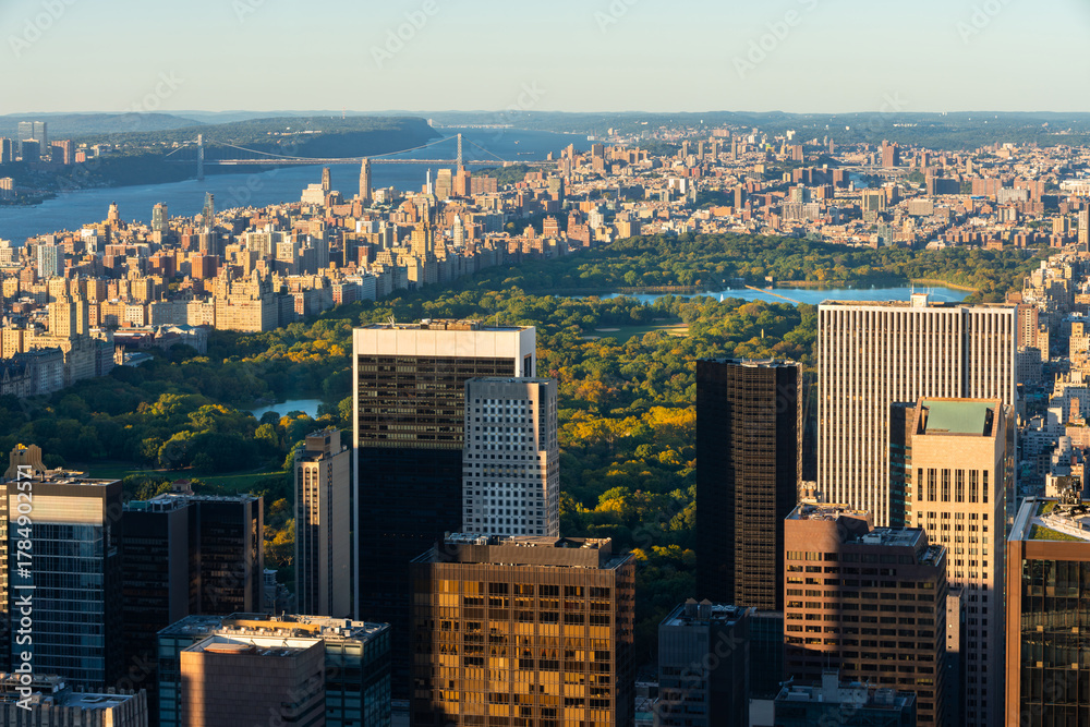Obraz premium New York City aerial afternoon view of Central Park and Upper West Side with Midtown skyscrapers. In the distance are Harlem, Upper Manhattan and the Hudson River