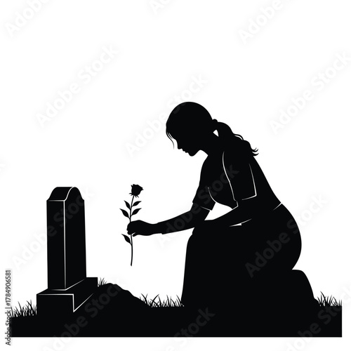 Silhouette of a woman mourning at a grave with a single rose