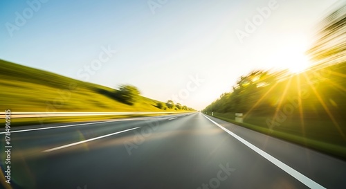 Open highway stretching towards the sun with motion blur effect background