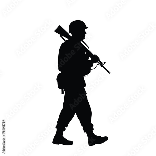 Silhouette of a soldier in uniform carrying a rifle on their shoulder walking forward
