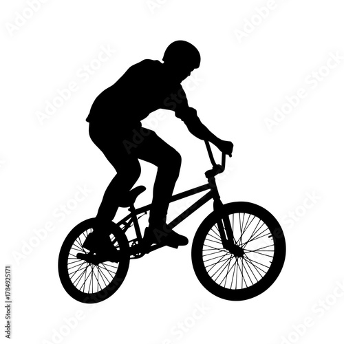 Silhouette of a BMX athlete in action