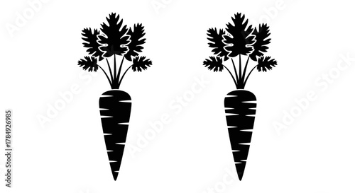 two black carrot silhouettes with leafy tops against white background