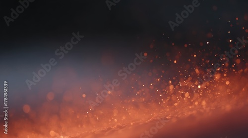 Fire sparks and glowing embers flying in dark space, abstract warm light frame from above and below