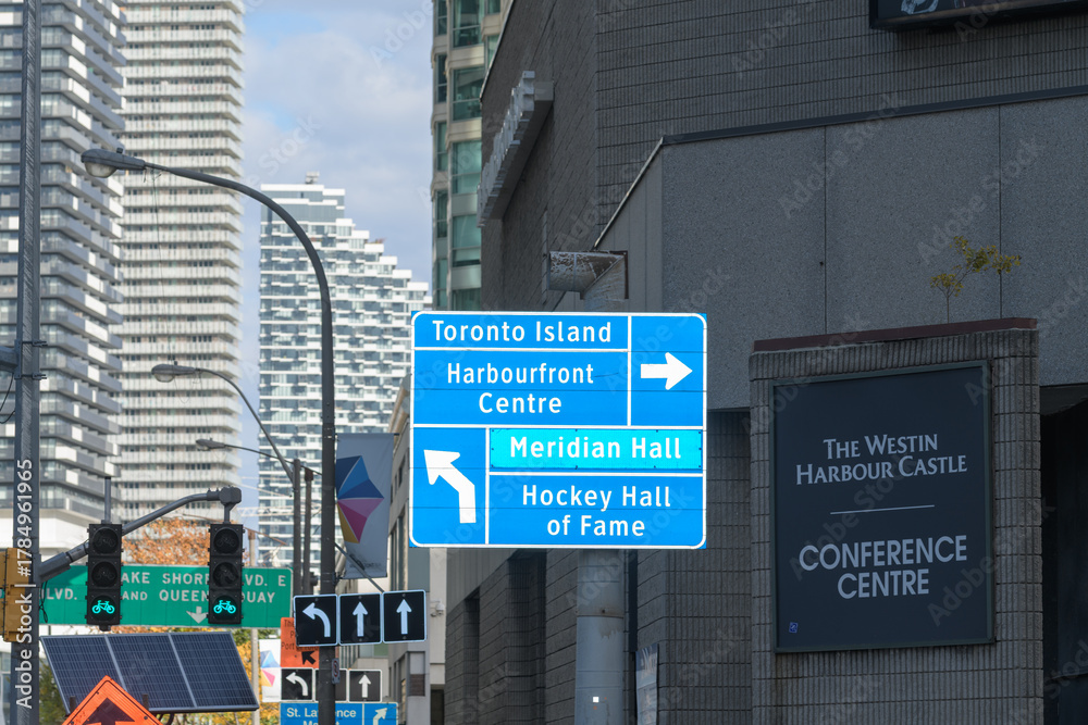 Obraz premium looking east on Harbour St at Bay St to traffic signs and directions including Westin Harbour Castle Conference Centre sign at 11 Bay St, Toronto