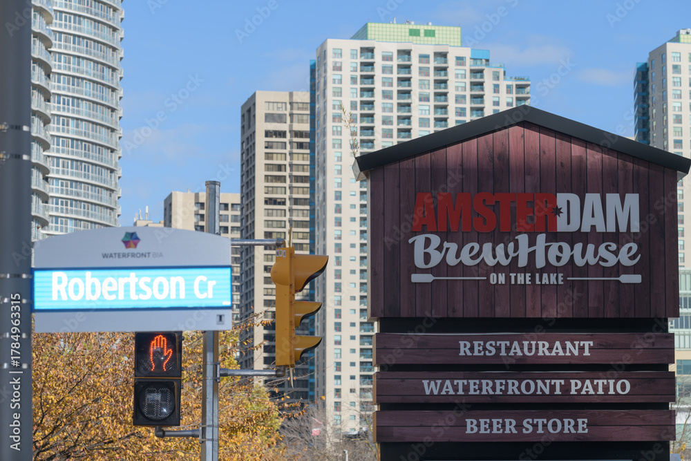 Fototapeta premium view of sign near Amsterdam Brewhouse, a brewpub, located at 245 Queens Quay W, Toronto (at Robertson Cr)