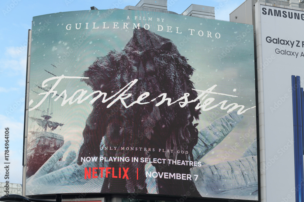 Fototapeta premium digital sign displaying Guillermo del Toro film Frankenstein at Sankofa Square, Toronto
