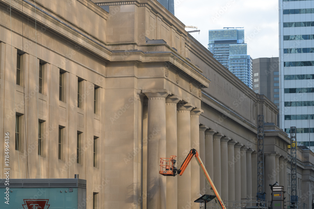 Fototapeta premium reflection of light from Royal Bank Plaza on the historic facade of Union Station, a monumental rail hub, designed by Ross and Macdonald, Hugh Jones, and John M Lyle, completed 1927, Toronto