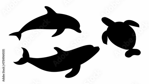 Elegant silhouettes of dolphins and sea turtle swimming gracefully, perfect for marine life designs