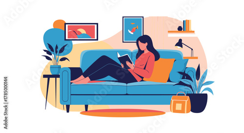 A woman is relaxing on a sofa and reading a book in a cozy living room.