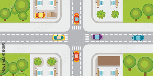 Top down view of a busy city intersection with cars and pedestrian crosswalks