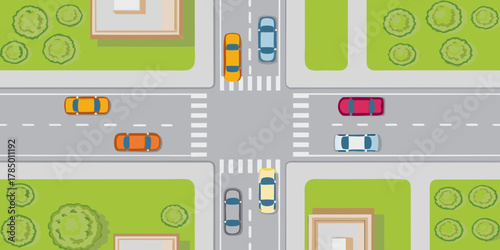 Top down view of a city intersection with cars and pedestrian crossings