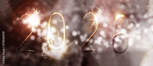 numbers 2026 made from sparklers on bokeh lights. New Year banner.