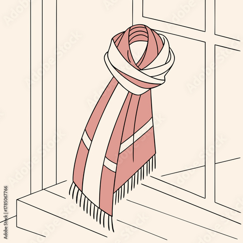 Knitted scarf draped on a windowsill with window frame Keywords: scarf, knitted, draped
