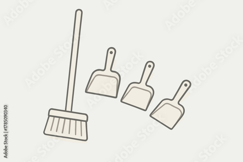 Broom and three dustpans for various household cleaning tasks