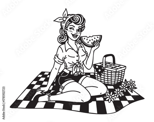Young caucasian woman in vintage attire sits on a checkered picnic blanket, holding a slice of watermelon with a wicker basket and flowers beside her.