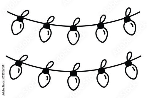 A string of decorative lights hangs suspended against a neutral background.