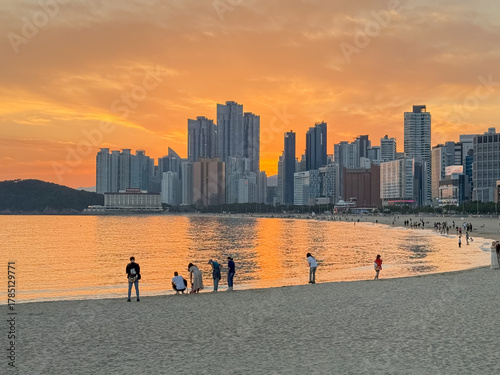 Busan City, South Korea, September 30, 2025: Busan Haeundae Beach Sunset View with Buildings, Ocean, Shops, People 부산 해운대 바닷가 일몰
