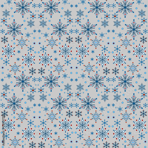 Seamless pattern of blue snowflakes on gray background. Winter seasonal snowfall background. Snowflakes with six rays. Christmas ornamental decor in classic colors