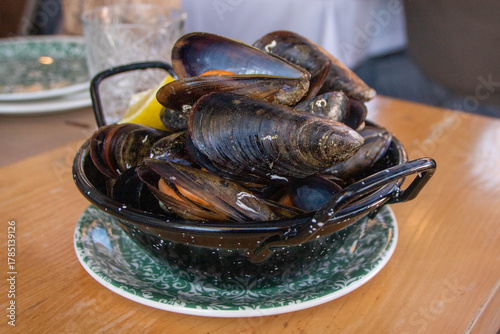 Plate of mussels cooked with wine and lemon
