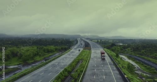 Wallpaper Mural Aerial view of the Mumbai-Nagpur Expressway, also known as Samruddhi Mahamarg, captured during the monsoon season. The modern highway stretches through lush green landscapes, rain-soaked fields. Torontodigital.ca