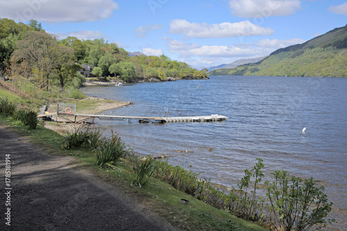 Фотография View north up the loch past a jetty and house, from the minor road near Firkin Point, a viewpoint off the A82 on the west shore of Loch Lomond, OS map ref NN 338 007, Argyll and Bute, Scotland