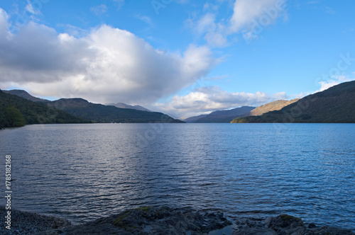 Evening view up the loch to Ben Vorlich and the distant Tyndrum hills from Firkin Point, a viewpoint off the A82 on the west shore of Loch Lomond, OS map ref NN 338 007, Argyll and Bute, Scotland.