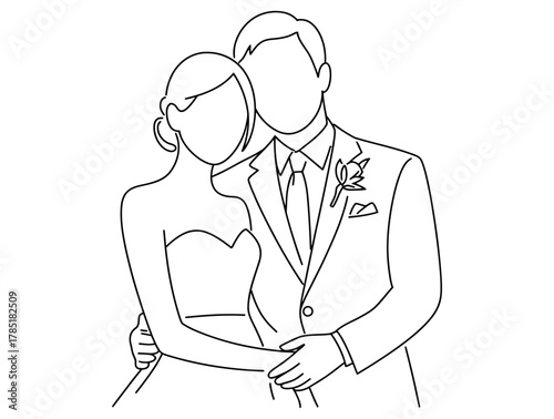 A bride and groom stand together, embracing in a tender moment.