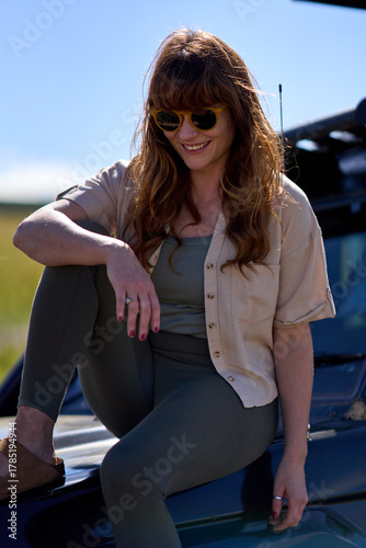 Ginger woman with sunglasses on Safari