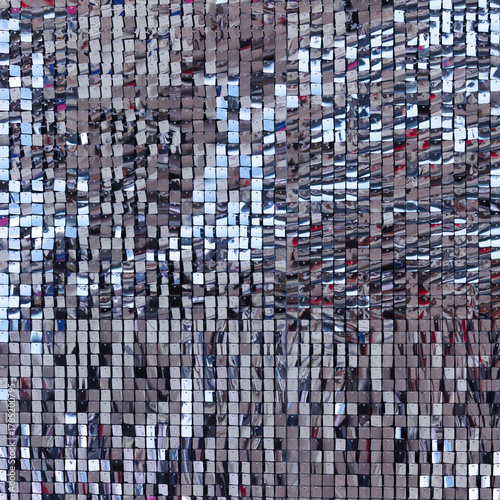 Abstract background with shiny reflective square sequins in different colors