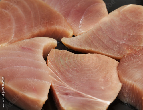 Raw uncooked thick Yellowfin tuna steaks 