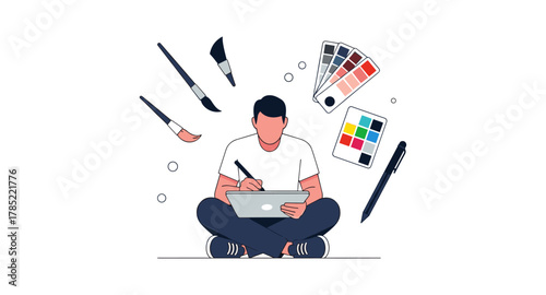 Artist engaged in digital painting with tablet and art supplies