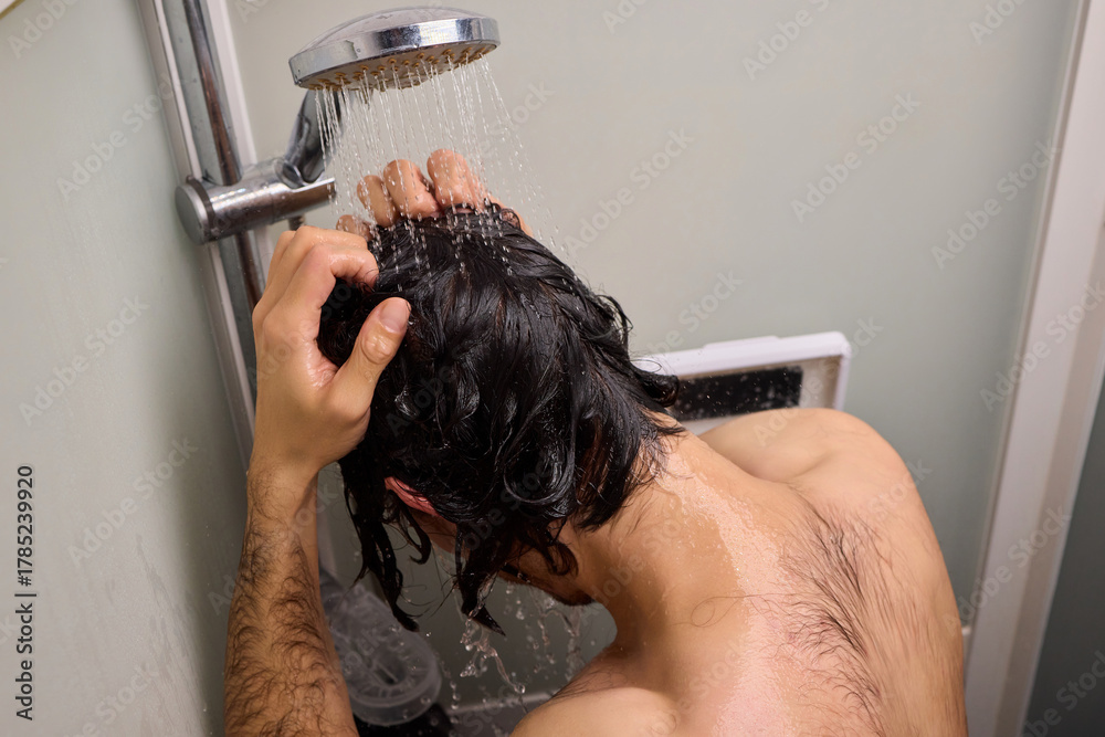 Naklejka premium Personal hygiene routine, Cleaning and relaxing shower time, Individual cleansing session in steamy bathroom, Relaxing personal grooming amidst humid shower environment