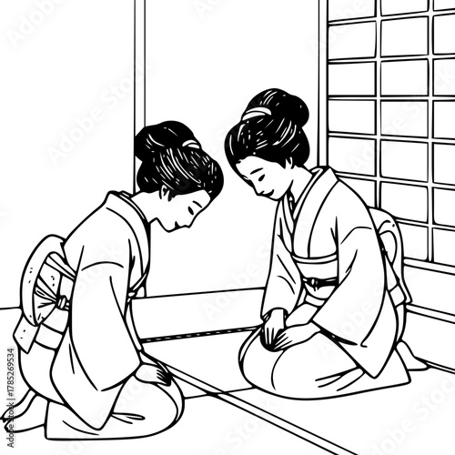 Two women bowing wearing traditional kimono
