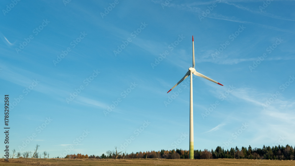Fototapeta premium Wind Turbine on Field with Blue Sky