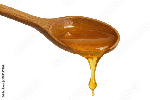 Wallpaper Mural Honey dripping from wooden spoon showing golden liquid sweet food ingredient on transparent background Torontodigital.ca