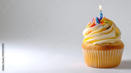 Colorful Birthday Cupcake with Candle on White Background